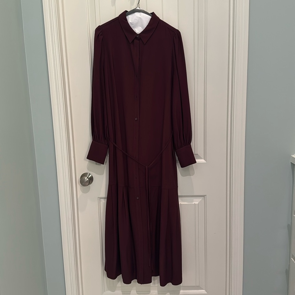 Cute long button down dress with a tie that is waist level